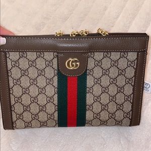 Brand new Gucci bag with gold chain. You can even use it as a clutch.